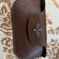 جلد عینک و سیگار و فندک