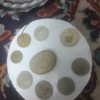 چند عدد سکه ویه عدد سنگ اسیاب اصل