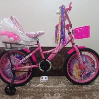 دوچرخه سایز ۲۰و۱۲دخترانه صورتی رنگ تمیز درحد