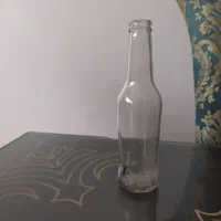بطری شیشه ای کوچک همراه با درب