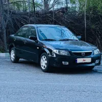 مزدا ۳۲۳ اتوماتیک تیپ ۵ مدل ۸۵ مشکی متالیک سند دوم