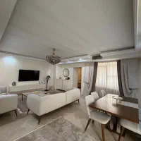 آپارتمان-57متر-سالن-پرده-خور-نما-تراورتن