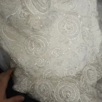 لباس عروس به همراه مقداری پنل و تور