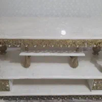 زیر تلوزیون برنجی