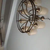 یک لوستر 8 شاخه و دو عدد دیوار کوب