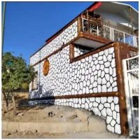 پلاستر سوله دامداری مرغدار دیوار . نما طرح سنگ چوب