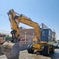 بیل مکانیکی HE100 B1 لاستیکی 2010