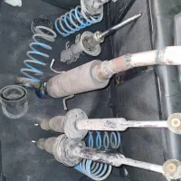 منبع اگزوز و کمک فنر و لول فنر