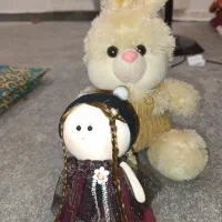 دو عدد عروسک خرس و دختر روسی