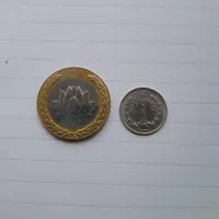 سکه ۲۵ تومانی و پهلوی و سنگ