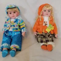 دو عدد عروسک پسر و دختر موزیکال زیبا و جذاب