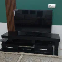 تلویزیون LG ال جی به همراه میز تلویزیون دو تیکه