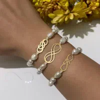 دستبند طلا و مروارید کادویی زیر گرمی