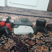 دودستگاه دکیPS1وPS2 و ۵تا دسته و ۳۰ تا دیسک وفلش.