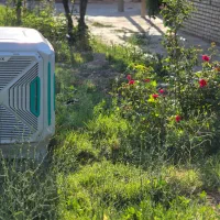 کولر آبی ایرومکس مدل 8000 روبه رو زن 10 سال خدمات
