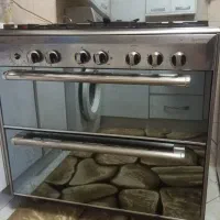 گاز ۵ شعله تمام استیل.و ۱عدد پرده عقب هایما