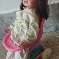 کالسکه اسباب بازی همراه با عروسک