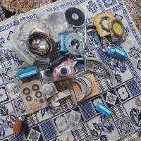 یک سری لوازم موتور ۱۲۵ یاماها تمیز و سالم و نو