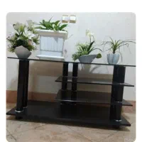 میز تلوزیون شیشه ای کاملن سالم فقد به پول نیاز دار