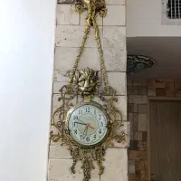 ساعت دیواری و سطل و جا دستمال کاغذی برنز