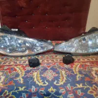 دوعددچراغ ۲۰۶ و دوعدد موتور تنظیم چراغ