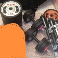 وزنه و دمبل دور لاستیک