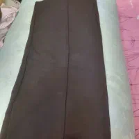 یک کیف دو جفت کفش یک دورس نارنجی و یک شلوار ورزشی