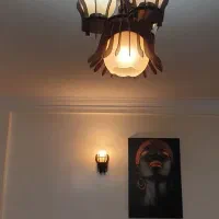 لوستر چهار شعله و دیوار کوب چوبی