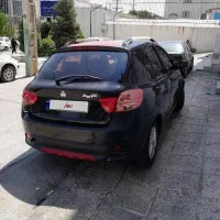 کوییک مشکی قرمز کم کار