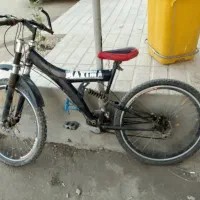 دوچرخه حرفه ای کمک فنر داره دنده ای