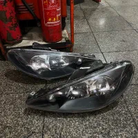 یک جفت چراغ جلو پژو 206 اسپرت داخل مشکی