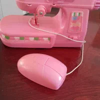 چرخ خیاطی و عروسک (اسباب بازی)