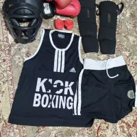 لوازم کیک بوکسینگ ،دستکش،کلاه،ساق بند،تاپ وشورت