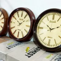 ساعت دیواری جدید رولکس آرام گرد رنگ عسلی گردویی