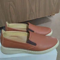 کفش آکبند و نوو|کیف، کفش، کمربند|مهاجران, |دیوار