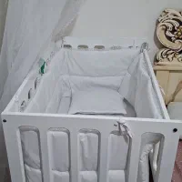 گهواره کنار تخت مادر