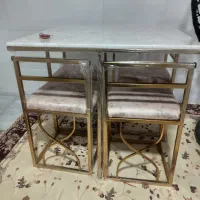 میز ناهارخوری چهار نفره ویک عدد تاب ریلکسی
