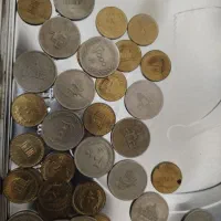 خیلی سکه و دو عدد سکه ۵۰۰ تومنی مرقد امام رضا