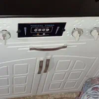 گاز و کمد تلویزیون و ساعت