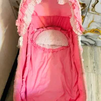 گهواره چرخدار صورتی