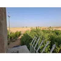 ۷ هکتار زمین دارای چاه عمیق و آبیاری بارانی و باغ