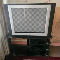 تلویزیون 29 اینچ همراه با زیر تلویزیونی شیشه ایی