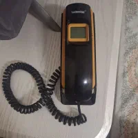 یک عدد تلفن دیواری و رو میزی