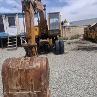 بیل 100 کوماتسو لاستیکی
