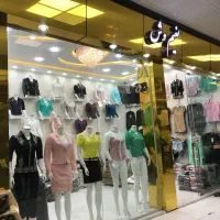 مغازه دو باب دو دهنه دیوار وسط برداشته شده