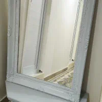 آینه کنسول و قفس پرنده