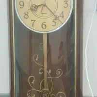 ساعت دیواری قاب قوسی پاندول دار