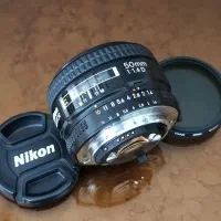 لنز نیکون 50mm 1.4D Nikon و اکستندر TC-200