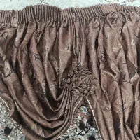 یه عدد یالان پرده رنگ طلایی قهوه‌ای بسیار شیک