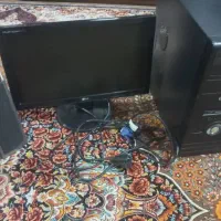 کیس کامپیوتر به همراه مانیتور و اسپیکر